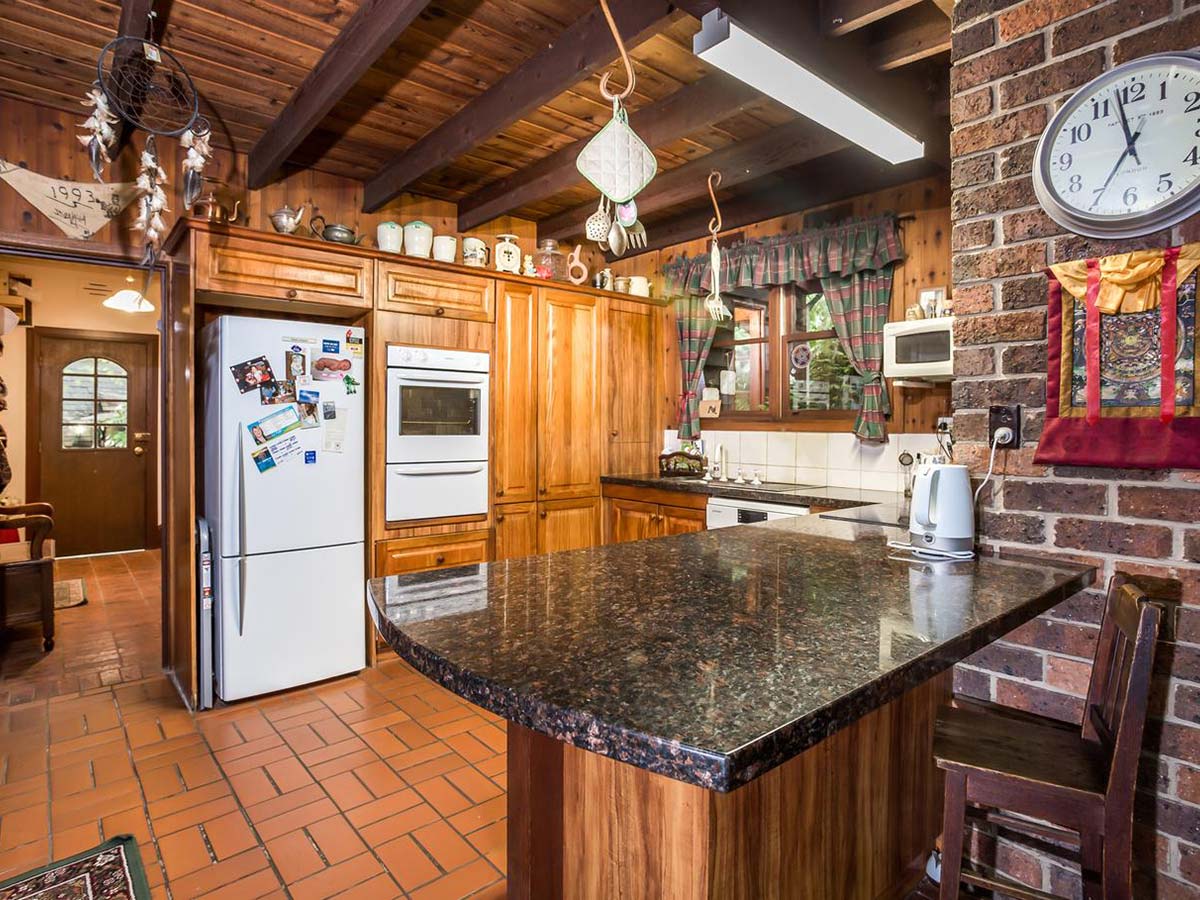 Kitchen with wood panelling