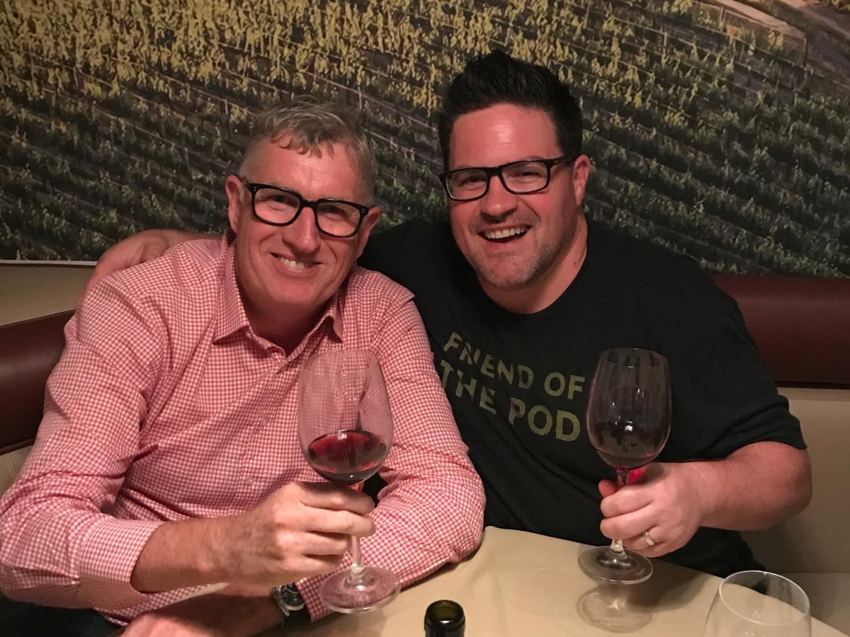 Two men drinking red wine