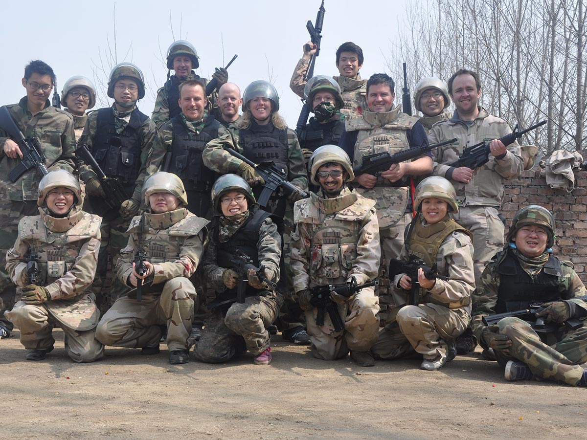 Team in Xi'an China goes paintballing after a legendary all night bender.